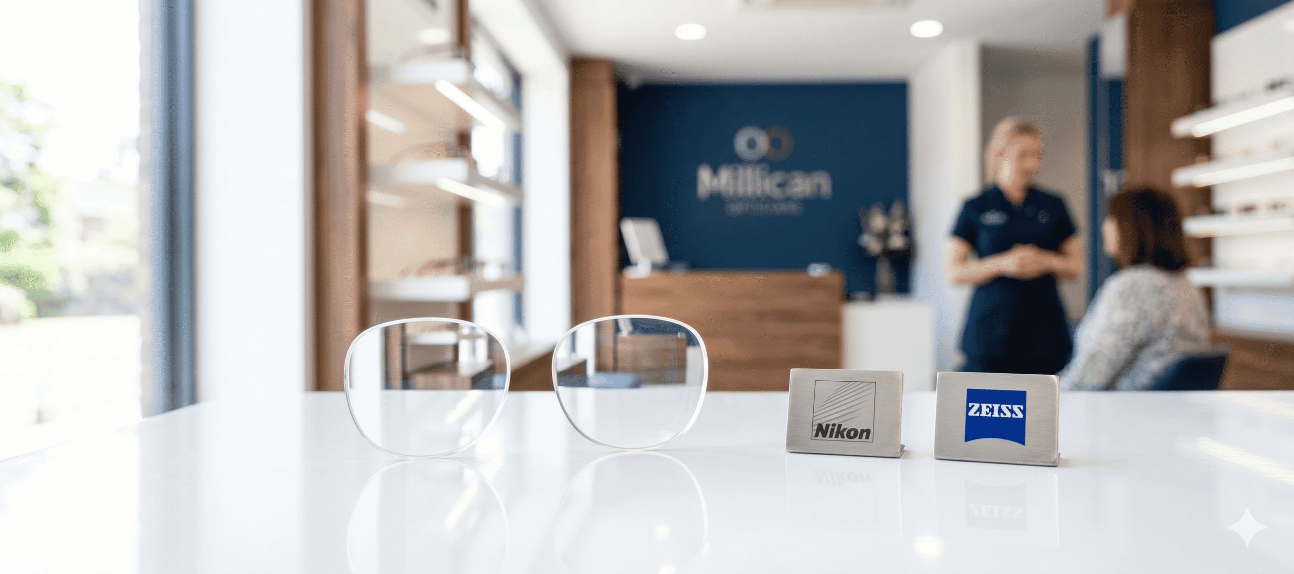 A premium display at Millican Opticians featuring high-quality Nikon and Zeiss spectacle lenses, representing the practice's commitment to world-class optical precision and clarity.